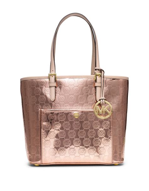 michael kors purse with roses on the side|Michael Kors gold metallic purse.